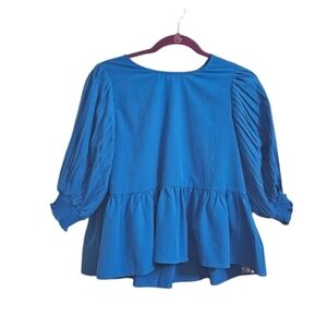 ENTRO Blue Pleated sleeves ruffle bottom satiny top. Size small NWT